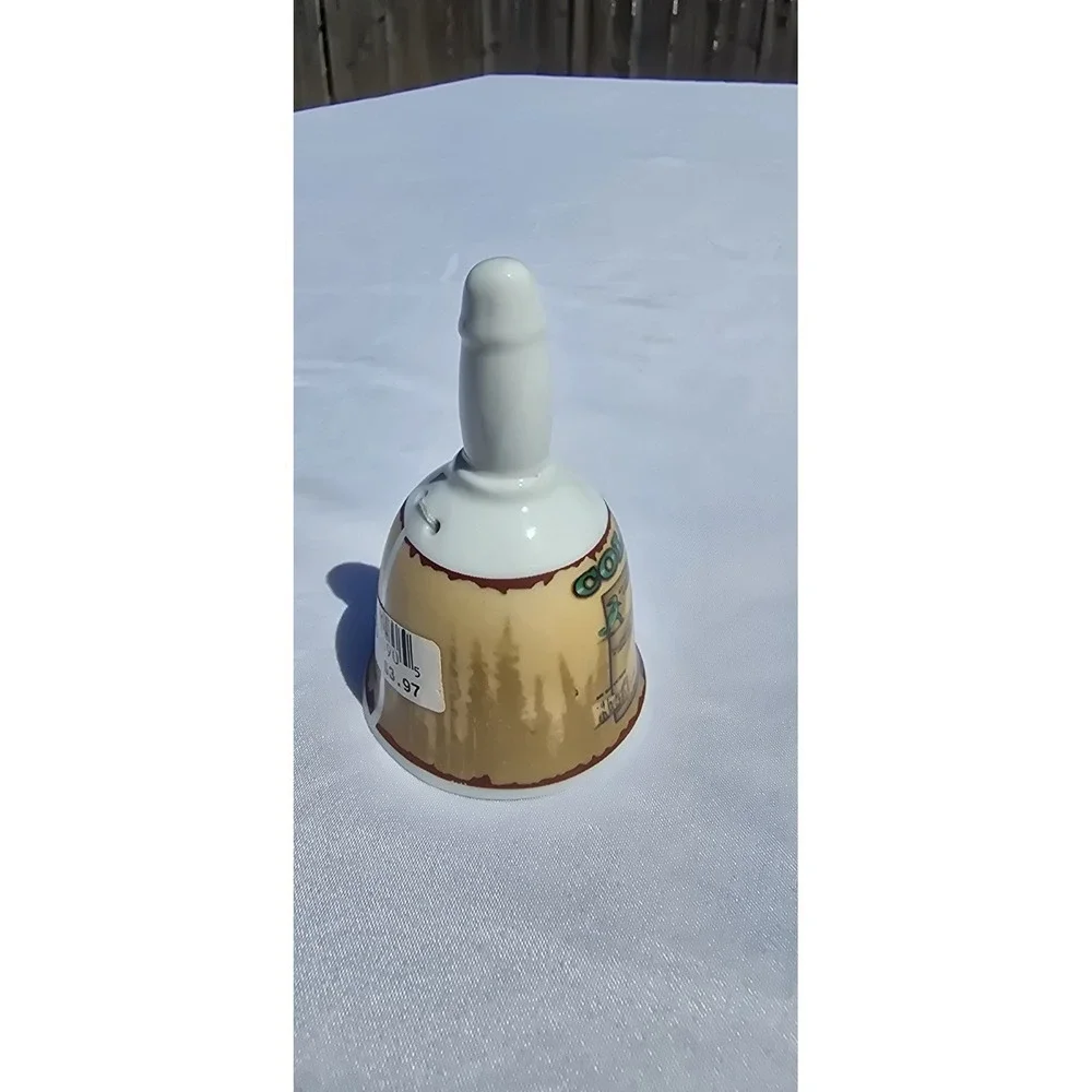 vintage/collectible porcelain souvenir bell featuring a map graphic of Colorado